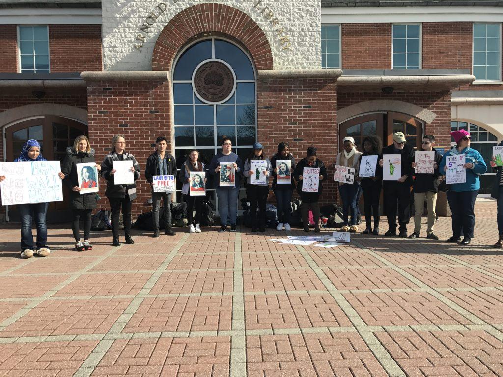 Members of the Quinnipiac community stand in solidarity on the Mount Carmel Campus