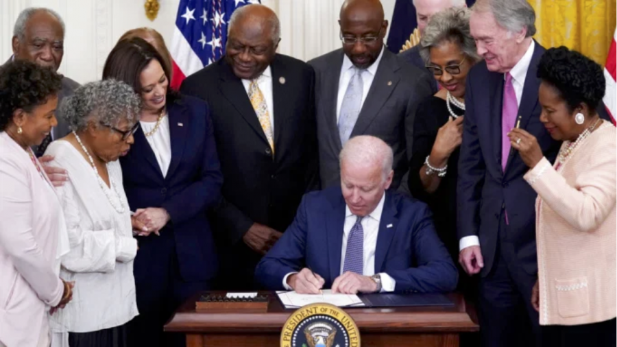 President Joe Biden signing the Juneteenth National Independence Day Act
(AP Photo/Evan Vucci)